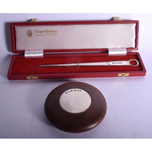 604 - A DAVID LINLEY SILVER PEBBLE PAPERWEIGHT together with a silver letter opener. (2)