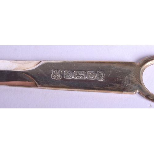 604 - A DAVID LINLEY SILVER PEBBLE PAPERWEIGHT together with a silver letter opener. (2)