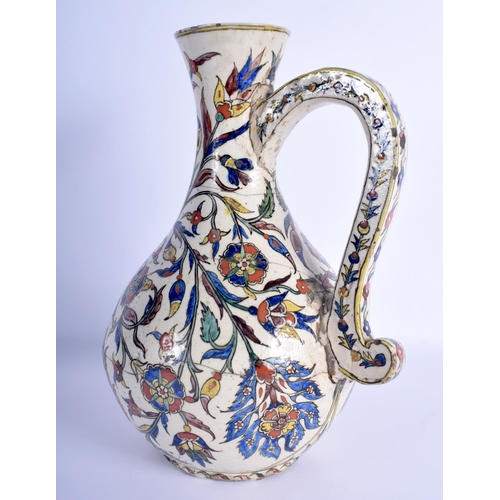 10 - A 19TH CENTURY CONTINENTAL IZNIK FAIENCE GLAZED ENAMELLED JUG possibly Kutahya (Ottoman) painted wit... 