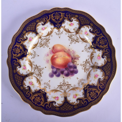 129 - Royal Worcester plate, the centre painted with fruit, signed: 'H. Ricketts', the border with rose sp... 