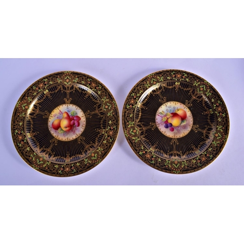 138 - Royal Worcester rare pair of art deco style plates painted with fruit by E. Townsend, one signed, on... 