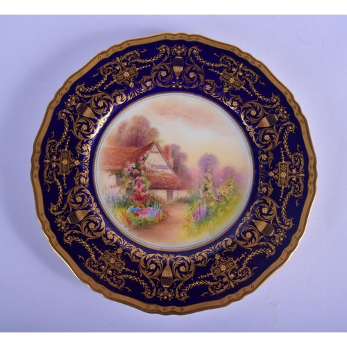 139 - Royal Worcester fine plate  by Raymond Rushton, signed, painted with an English country cottage and ... 