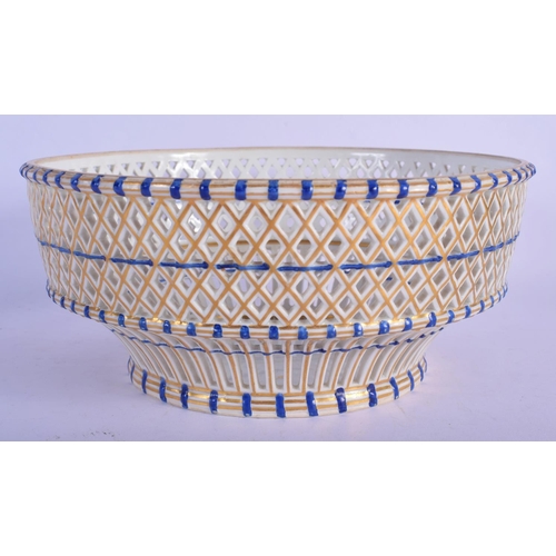 205 - 18th c. Vienna porcelain basket shaped bowl with pierced side picked out in blue and gold, beehive m... 