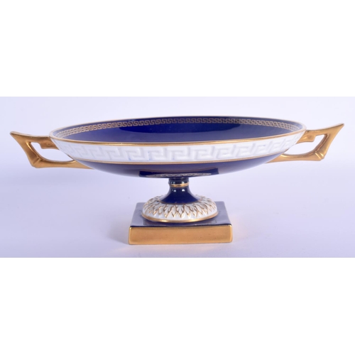 22 - A ROYAL WORCESTER TWIN HANDLED FRUIT PAINTED PORCELAIN PEDESTAL DISH by Bagnall. 20.5 cm wide.