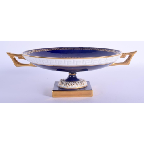 22 - A ROYAL WORCESTER TWIN HANDLED FRUIT PAINTED PORCELAIN PEDESTAL DISH by Bagnall. 20.5 cm wide.