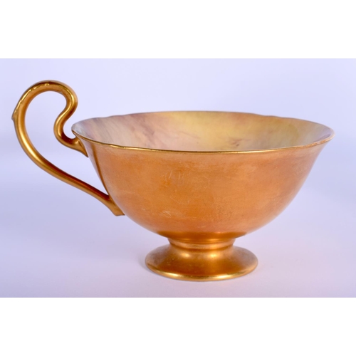 23 - A ROYAL WORCESTER PEDESTAL CUP AND SAUCER painted by Price. Saucer 12 cm diameter. (2)