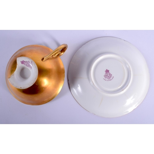 23 - A ROYAL WORCESTER PEDESTAL CUP AND SAUCER painted by Price. Saucer 12 cm diameter. (2)
