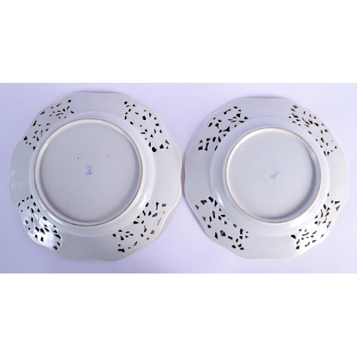 3 - A PAIR OF EARLY 20TH CENTURY DRESDEN RETICULATED PORCELAIN PLATES painted with flowers. 26 cm wide.