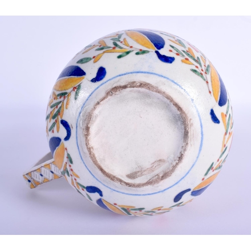 30 - A TURKISH OTTOMAN KUTAHYA FAIENCE TYPE JUG painted with flowers. 16.5 cm high.