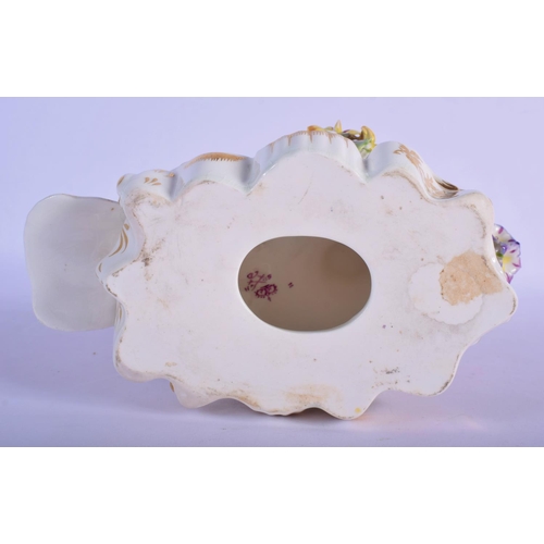 302 - A RARE EARLY 19TH CENTURY DERBY PORCELAIN FIGURE OF A PEACOCK modelled upon an encrusted base. 16 cm... 