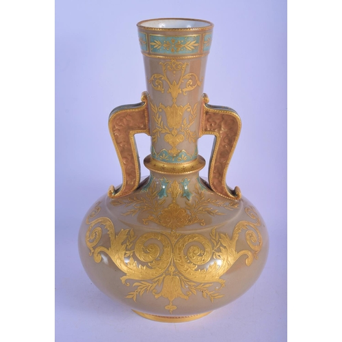303 - A 19TH CENTURY EUROPEAN TWIN HANDLED PORCELAIN VASE enamelled in relief with gilt flowers. 26 cm x 1... 