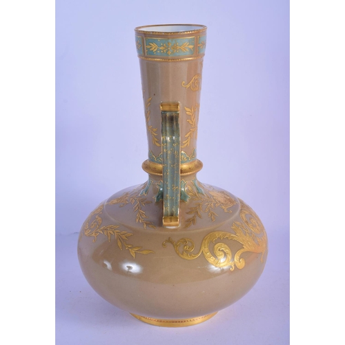 303 - A 19TH CENTURY EUROPEAN TWIN HANDLED PORCELAIN VASE enamelled in relief with gilt flowers. 26 cm x 1... 