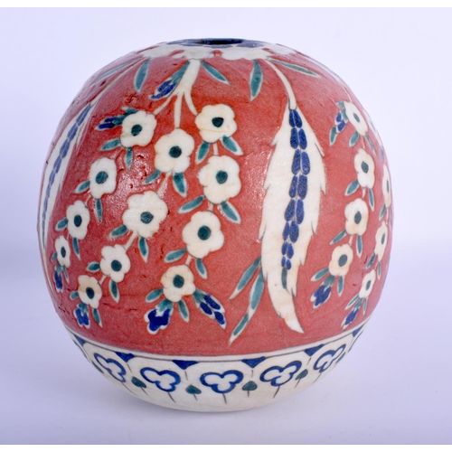 31 - A TURKISH OTTOMAN KUTAHYA FAIENCE TYPE HANGING MOSQUE BALL painted with flowers. 15 cm x 11 cm.