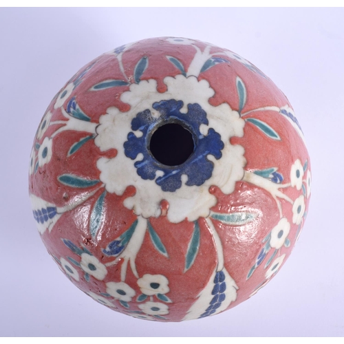 31 - A TURKISH OTTOMAN KUTAHYA FAIENCE TYPE HANGING MOSQUE BALL painted with flowers. 15 cm x 11 cm.