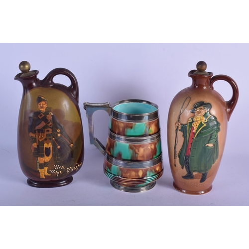 310 - TWO ROYAL DOULTON WHISKEY DECANTERS together with a silver plated majolica jug. Largest 23 cm high. ... 