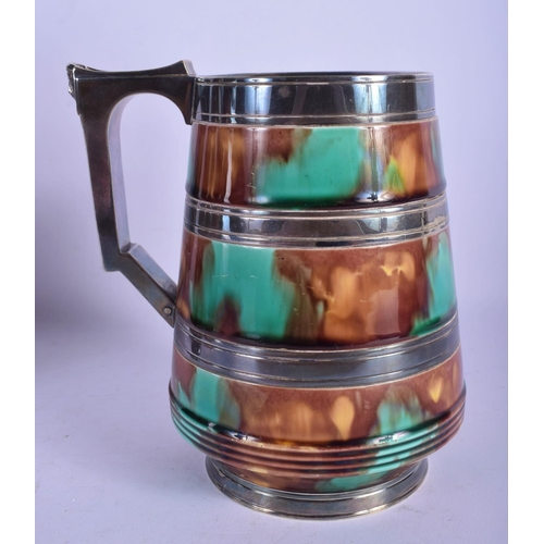 310 - TWO ROYAL DOULTON WHISKEY DECANTERS together with a silver plated majolica jug. Largest 23 cm high. ... 