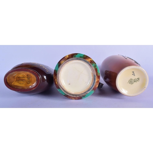 310 - TWO ROYAL DOULTON WHISKEY DECANTERS together with a silver plated majolica jug. Largest 23 cm high. ... 