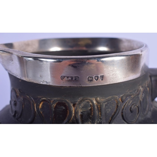 311 - AN ANTIQUE SILVER MOUNTED JOHN GILPIN BLACK GLAZED JUG together with a whitw glazed Moore type bowl.... 