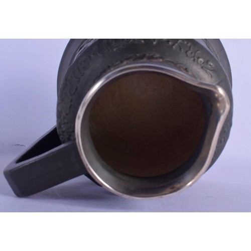 311 - AN ANTIQUE SILVER MOUNTED JOHN GILPIN BLACK GLAZED JUG together with a whitw glazed Moore type bowl.... 