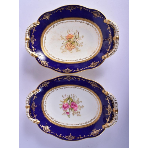 312 - AN ANTIQUE COALPORT PART DESSERT SERVICE decorated with foliage and seaweed scrolls. Largest 28 cm w... 