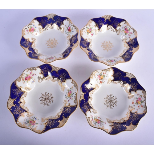 312 - AN ANTIQUE COALPORT PART DESSERT SERVICE decorated with foliage and seaweed scrolls. Largest 28 cm w... 