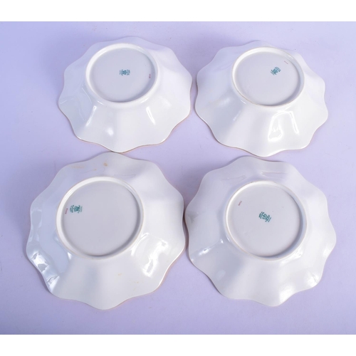 312 - AN ANTIQUE COALPORT PART DESSERT SERVICE decorated with foliage and seaweed scrolls. Largest 28 cm w... 