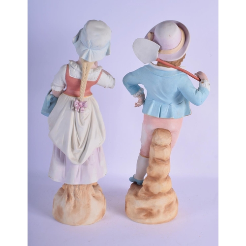 313 - A PAIR OF ANTIQUE BISQUE PORCELAIN FIGURES modelled upon naturalistic bases. 45 cm high.