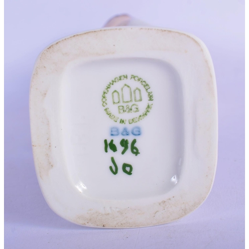 314 - A ROYAL COPENHAGEN PORCELAIN FIGURE OF A BOY modelled eating fruit. 18 cm high.