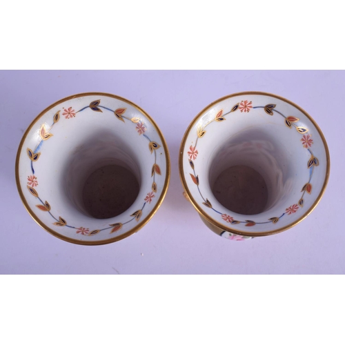 316 - A PAIR OF EARLY 19TH CENTURY SPODE IMARI VASES painted with flowers. 12 cm high.