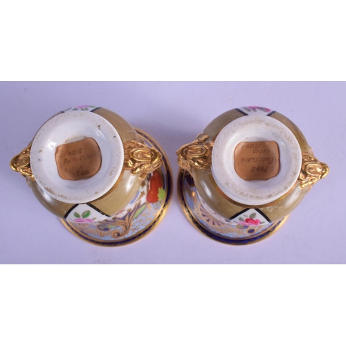 316 - A PAIR OF EARLY 19TH CENTURY SPODE IMARI VASES painted with flowers. 12 cm high.