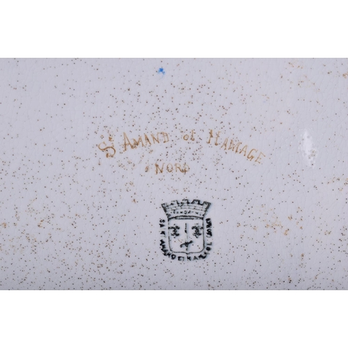 321 - A LARGE ANTIQUE TIN GLAZED POTTERY SERVING TRAY painted with flowers and motifs. 60 cm x 45 cm.