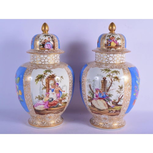 328 - A LARGE PAIR OF 19TH CENTURY GERMAN AUGUSTUS REX VASES AND COVERS painted with lovers. 37 cm x 18 cm... 