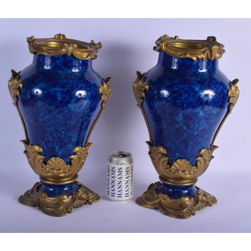 329 - A FINE PAIR OF 19TH CENTURY FRENCH BLUE PORCELAIN VASES overlaid with gilt bronze acanthus mounts. 4... 