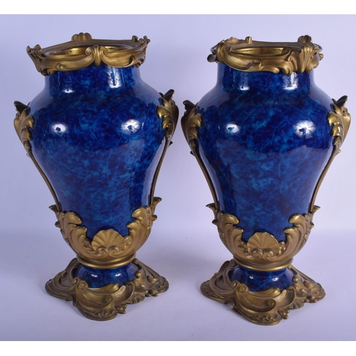 329 - A FINE PAIR OF 19TH CENTURY FRENCH BLUE PORCELAIN VASES overlaid with gilt bronze acanthus mounts. 4... 