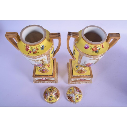 33 - A LARGE PAIR  OF ANTIQUE GERMAN AUGUSTUS REX TWIN HANDLED PORCELAIN VASE AND COVER painted with figu... 
