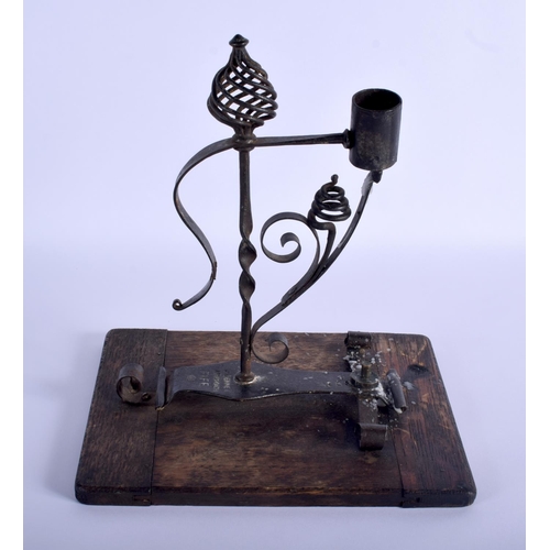330 - A RARE ANTIQUE SCOTTISH J BENNET OF FIFE WROUGHT IRON RUSHNIP TYPE CANDLE upon a wood plinth. 26 cm ... 