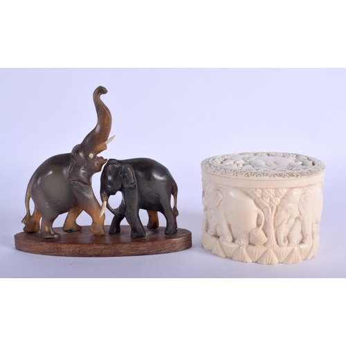 333 - A 19TH CENTURY MIDDLE EASTERN RHINOCEROS HORN FIGURE OF ELEPHANTS together with a carved ivory box a... 