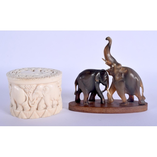333 - A 19TH CENTURY MIDDLE EASTERN RHINOCEROS HORN FIGURE OF ELEPHANTS together with a carved ivory box a... 