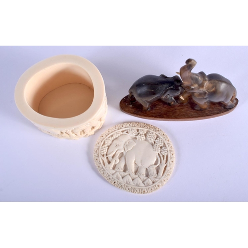 333 - A 19TH CENTURY MIDDLE EASTERN RHINOCEROS HORN FIGURE OF ELEPHANTS together with a carved ivory box a... 