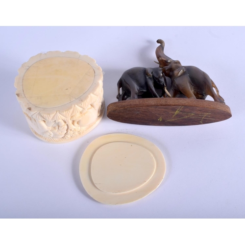 333 - A 19TH CENTURY MIDDLE EASTERN RHINOCEROS HORN FIGURE OF ELEPHANTS together with a carved ivory box a... 