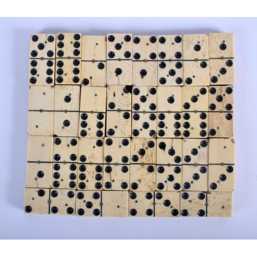 335 - A COLLECTION OF ANTIQUE BONE AND WOOD DOMINOS. (qty)