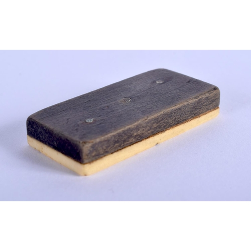 335 - A COLLECTION OF ANTIQUE BONE AND WOOD DOMINOS. (qty)