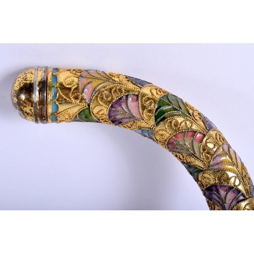 338 - A VINTAGE CONTINENTAL BRASS AND ENAMEL WALKING CANE. 90 cm long.