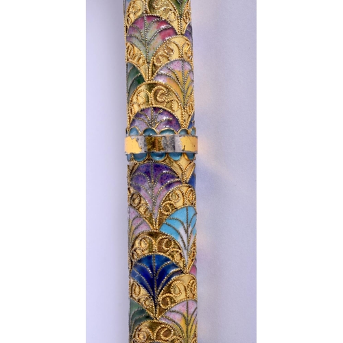 338 - A VINTAGE CONTINENTAL BRASS AND ENAMEL WALKING CANE. 90 cm long.