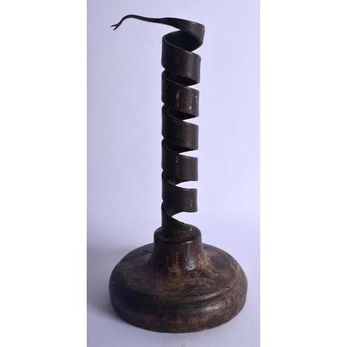 353 - AN EARLY CONTINENTAL PIGS TAIL SPIRAL CANDLESTICK. 20 cm high.