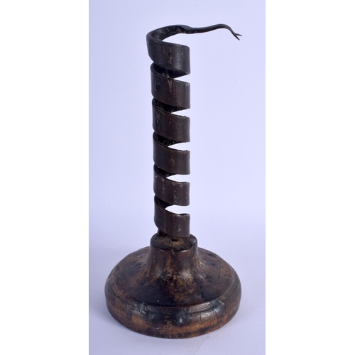 353 - AN EARLY CONTINENTAL PIGS TAIL SPIRAL CANDLESTICK. 20 cm high.