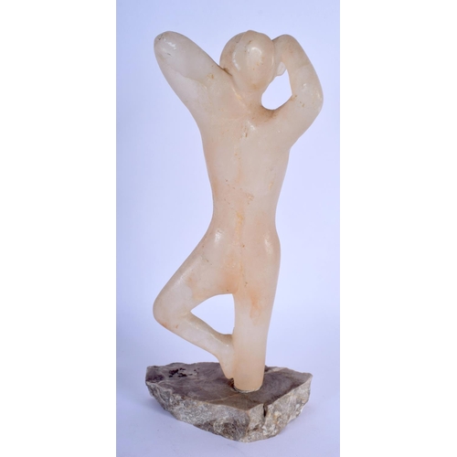 365 - AN ART DECO CARVED STONE FIGURE OF A NUDE FEMALE upon a stone base. 24 cm high.