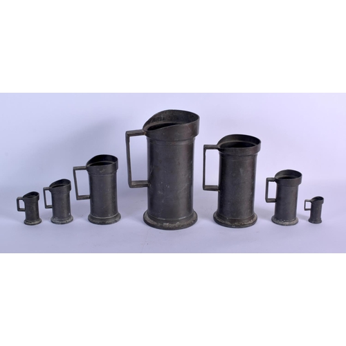 371 - SEVEN ANTIQUE PEWTER MEASURES. Largest 24 cm high. (7)