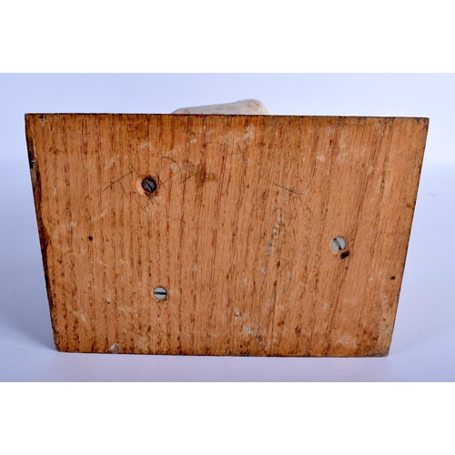 372 - AN AFRICAN WHITE PAINTED TRIBAL CARVED WOOD FIGURE modelled upon a stool. 40 cm high.