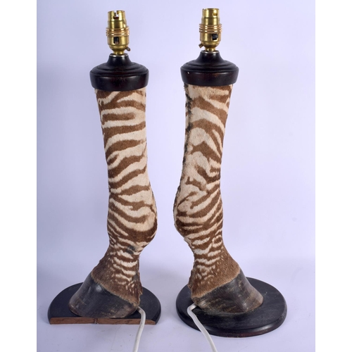373 - A LARGE PAIR OF 19TH CENTURY TAXIDERMY GIRAFFE FOOT LAMPS. 47 cm high.
